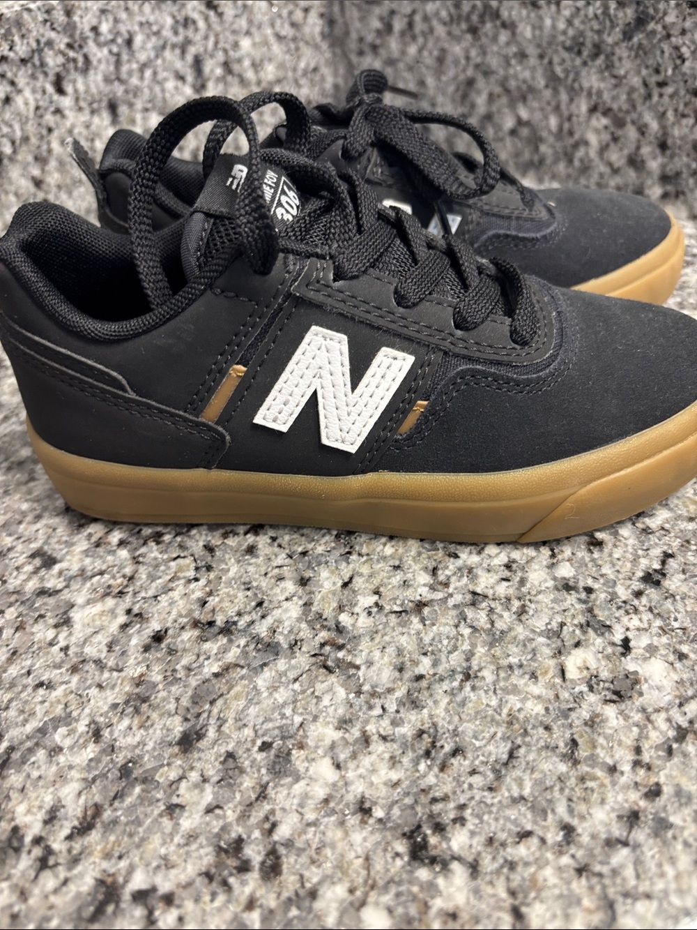 New Balance Kids Black Sneakers with Gum Sole and White N Logo